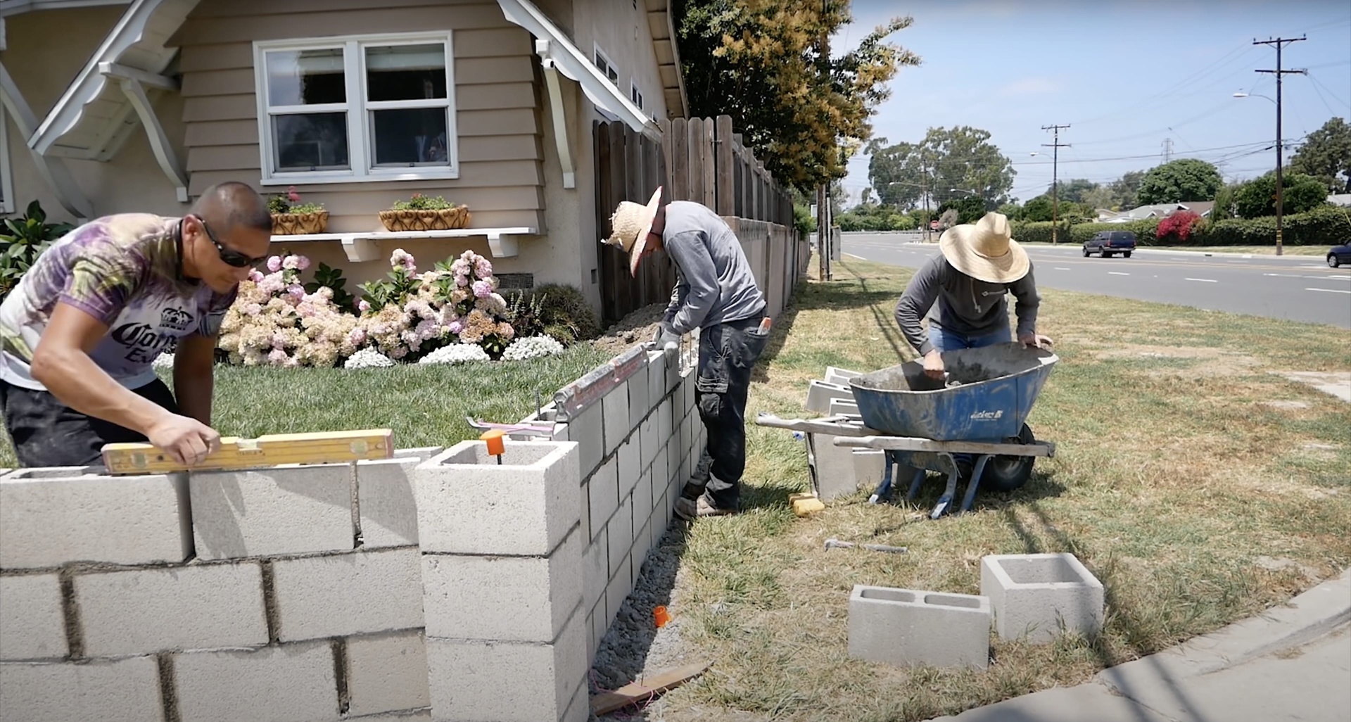 Professional concrete contractors working on retaining wall installation in Hudson, NH
