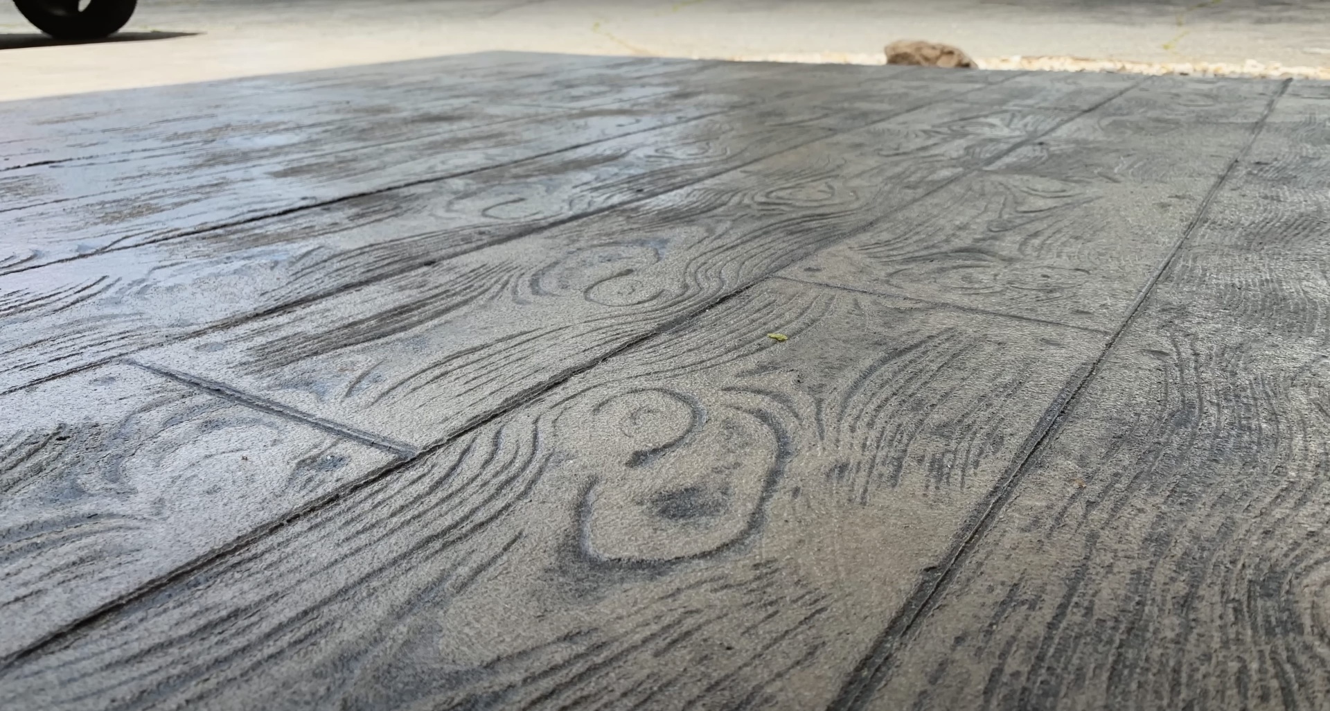 Wood-grain stamped concrete patio with realistic texture finish