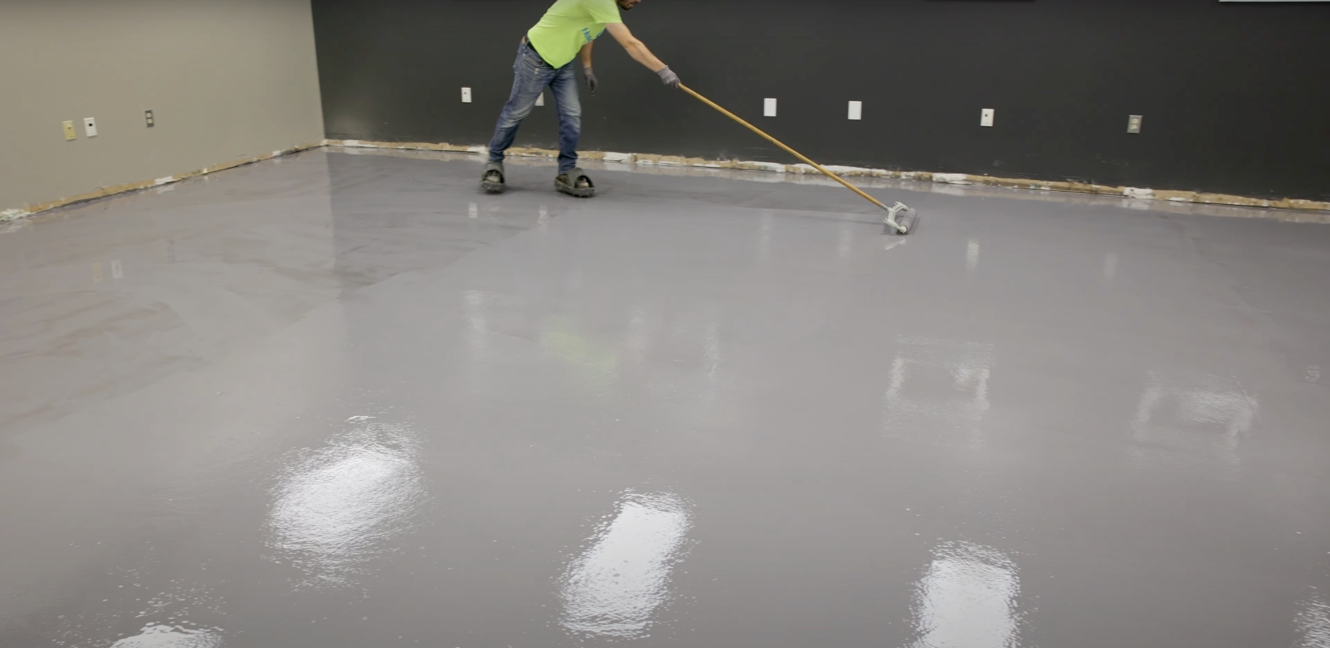 Commercial concrete floor installation with professional finishing equipment